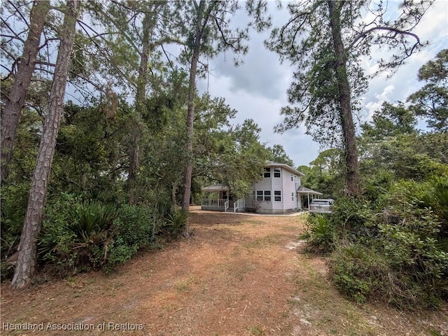 9131 Bridle Path, Sebring, FL 33875 - view of yard featuring dirt driveway