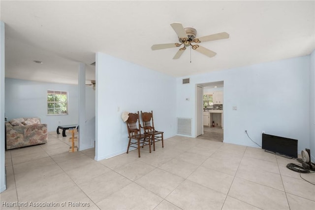 9131 Bridle Path, Sebring, FL 33875 - spare room with ceiling fan and light tile patterned floors