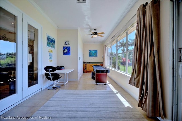 interior space featuring visible vents and a ceiling fan