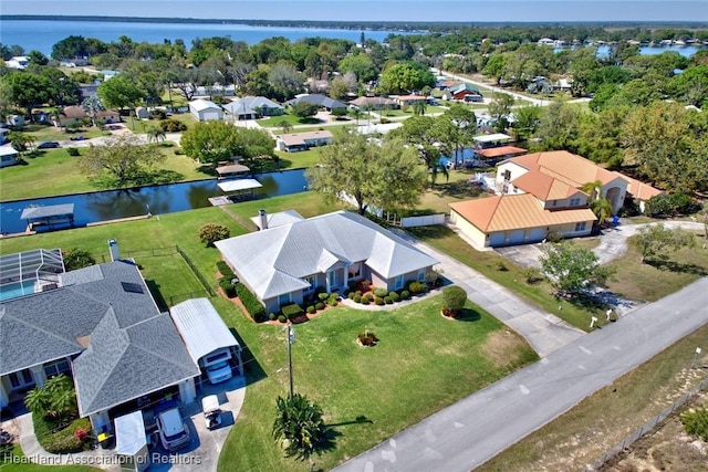 bird's eye view with a water view and a residential view