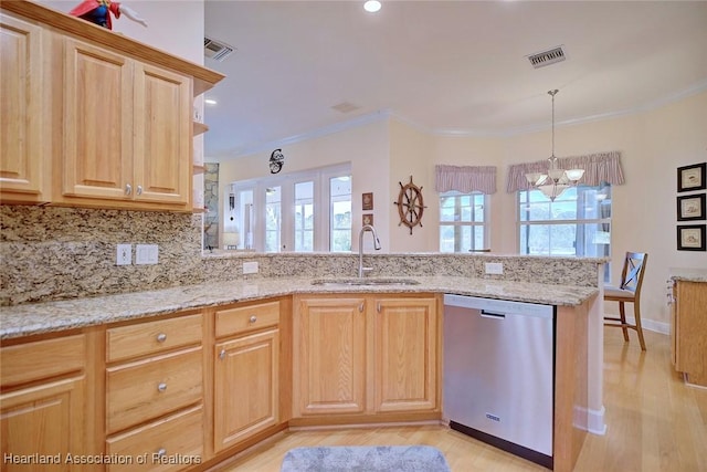 kitchen with a sink, visible vents, dishwasher, and ornamental molding