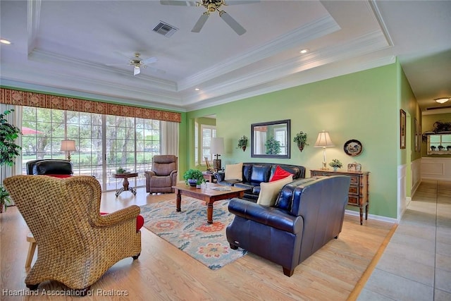 3421 E Glen Eagles Dr, Avon Park, FL 33825 - living room featuring a tray ceiling, ceiling fan, ornamental molding, plenty of natural light, and recessed lighting