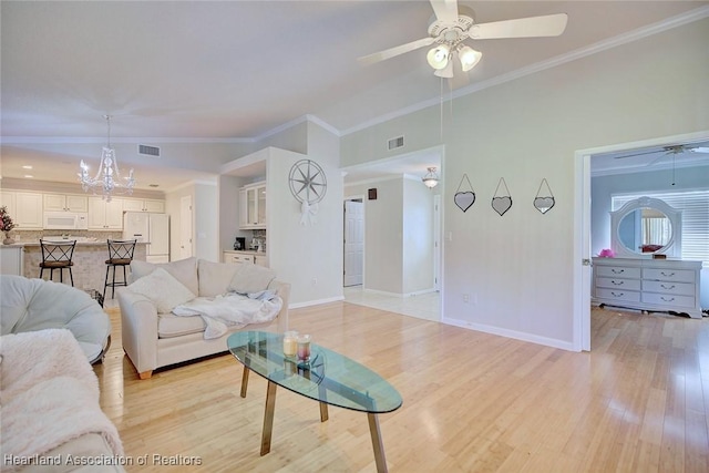 living room featuring light wood-type flooring, ceiling fan with notable chandelier, and ornamental molding