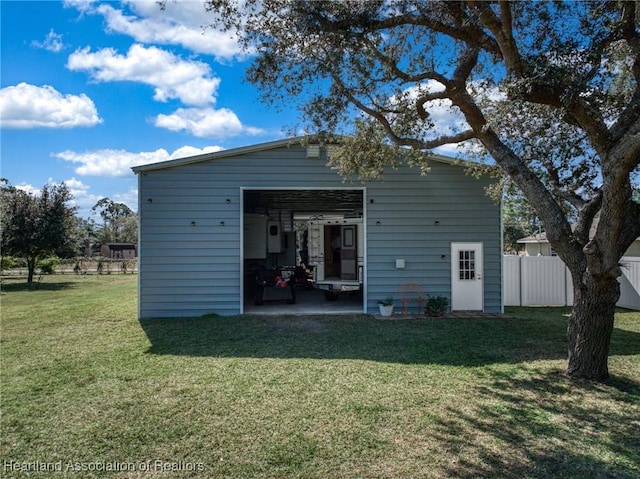 view of outdoor structure featuring a lawn