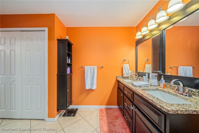 bathroom with tile patterned flooring and vanity