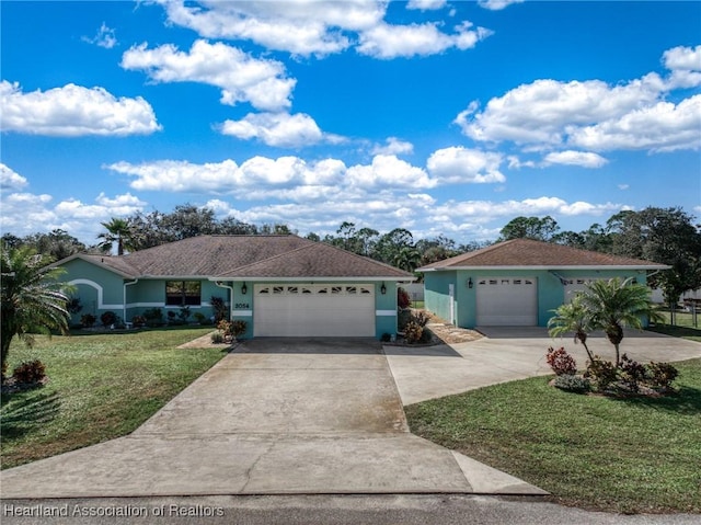 single story home featuring a garage and a front lawn