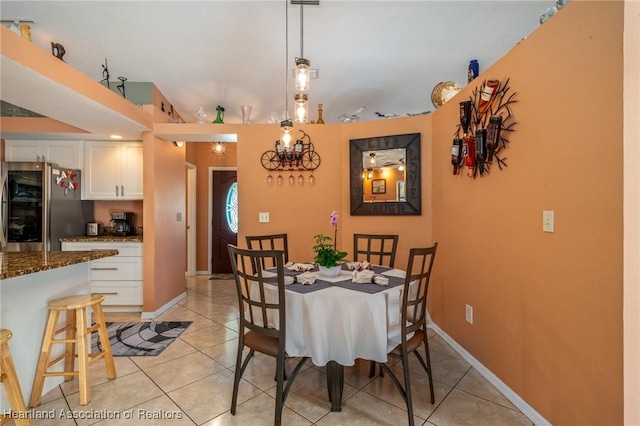 dining area featuring light tile patterned floors