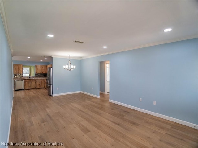 956 Shamrock Dr, Sebring, FL 33875 - unfurnished living room featuring crown molding, a chandelier, baseboards, recessed lighting, and light wood-style floors