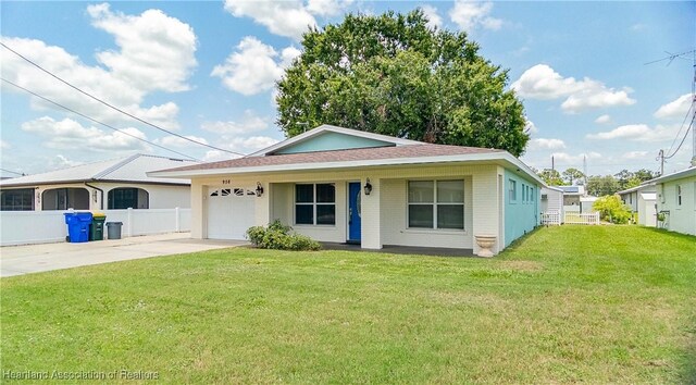 956 Shamrock Dr, Sebring, FL 33875 - view of front facade featuring driveway, a garage, brick siding, and roof with shingles