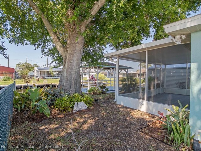 956 Shamrock Dr, Sebring, FL 33875 - view of yard with a sunroom