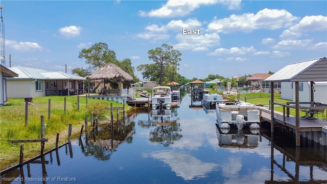 956 Shamrock Dr, Sebring, FL 33875 - view of property's community featuring a water view, a boat dock, boat lift, a residential view, and a yard
