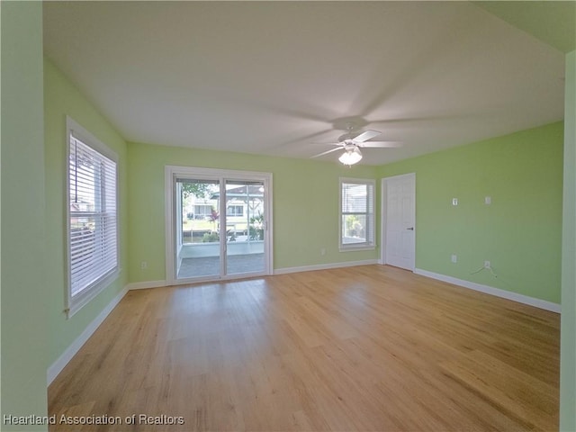 956 Shamrock Dr, Sebring, FL 33875 - unfurnished room featuring healthy amount of natural light, light wood-style flooring, and baseboards