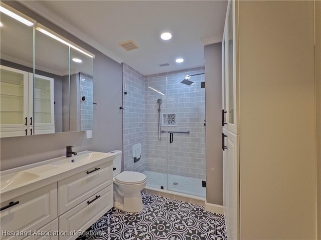 956 Shamrock Dr, Sebring, FL 33875 - bathroom featuring ornamental molding, a stall shower, toilet, double vanity, and tile patterned floors