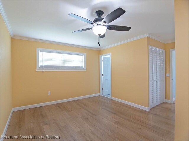 956 Shamrock Dr, Sebring, FL 33875 - spare room featuring light wood finished floors, ornamental molding, ceiling fan, and baseboards