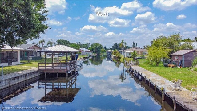 956 Shamrock Dr, Sebring, FL 33875 - dock featuring a gazebo, a water view, a yard, and a residential view