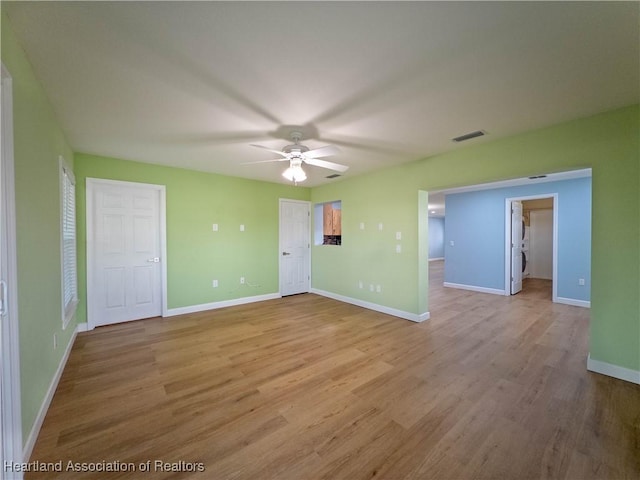 956 Shamrock Dr, Sebring, FL 33875 - unfurnished room featuring ceiling fan, light wood-type flooring, and baseboards