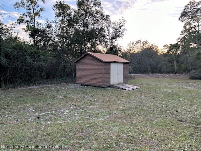 yard at dusk with a storage unit