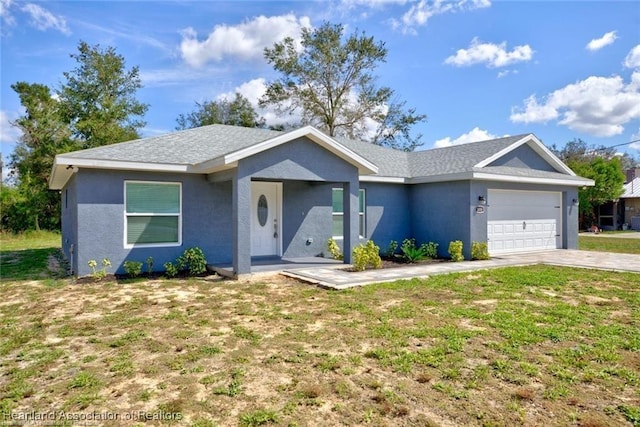 ranch-style home with stucco siding, driveway, a front lawn, and a garage