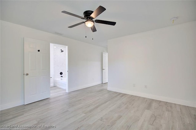 unfurnished room featuring visible vents, baseboards, light wood-style flooring, and a ceiling fan