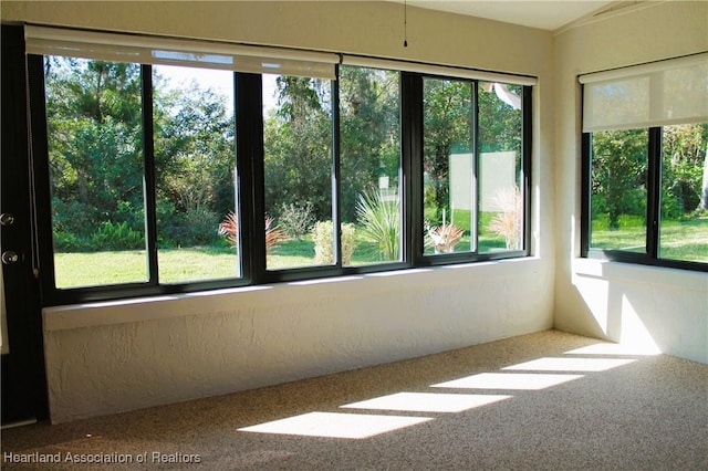 unfurnished sunroom with a healthy amount of sunlight