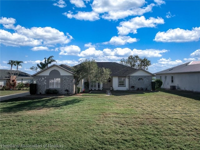 ranch-style home featuring a front yard