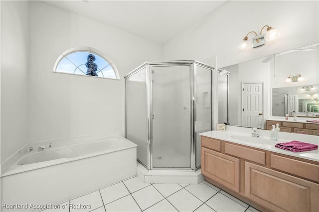 bathroom featuring tile patterned flooring, vanity, lofted ceiling, and independent shower and bath