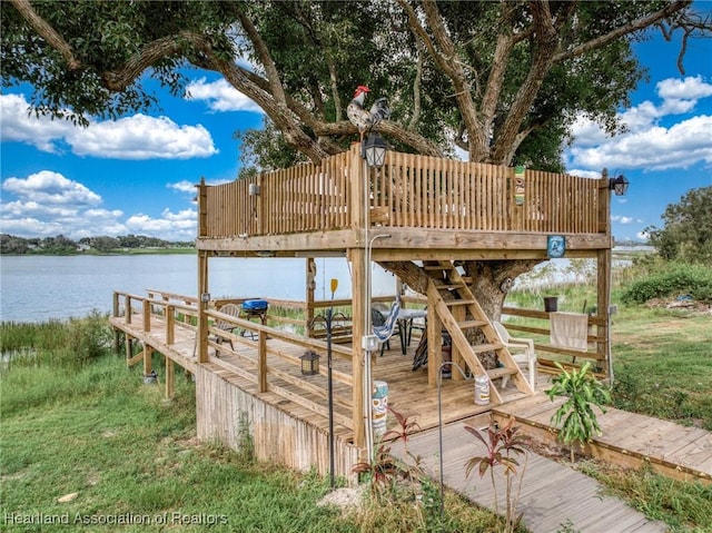 exterior space with a deck with water view