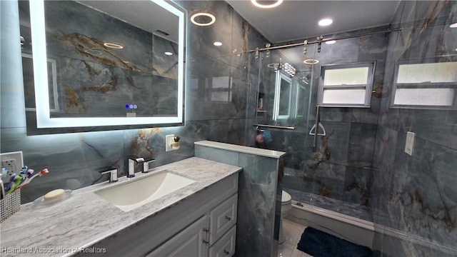 1022 Marble Ave, Avon Park, FL 33825 - full bath with toilet, a stall shower, tile walls, and vanity
