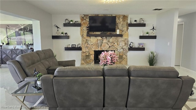 1022 Marble Ave, Avon Park, FL 33825 - living room featuring visible vents and a stone fireplace