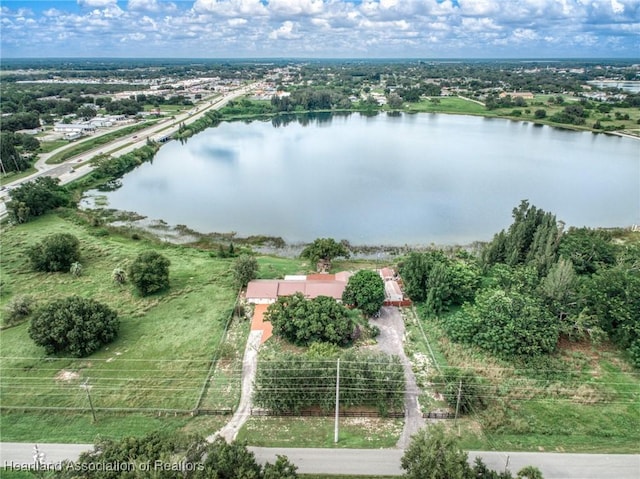 birds eye view of property with a water view