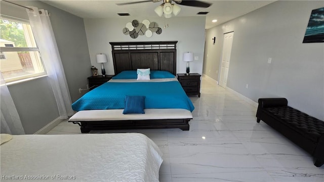 1022 Marble Ave, Avon Park, FL 33825 - bedroom featuring marble finish floor, a ceiling fan, visible vents, and baseboards