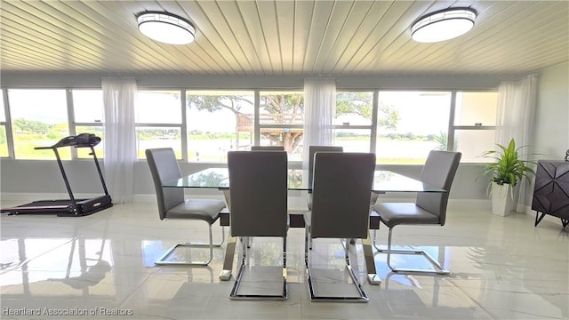 1022 Marble Ave, Avon Park, FL 33825 - dining space featuring wooden ceiling, plenty of natural light, and baseboards