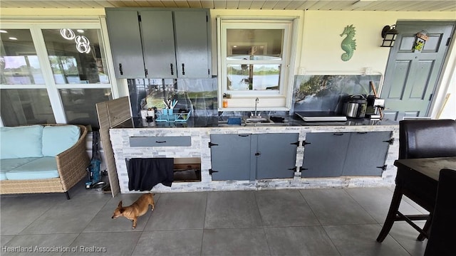 1022 Marble Ave, Avon Park, FL 33825 - kitchen with a sink and dark tile patterned flooring