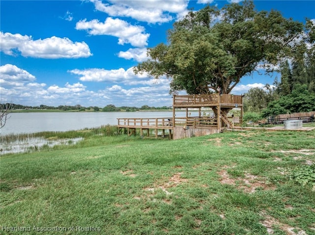 1022 Marble Ave, Avon Park, FL 33825 - view of dock with a water view and a lawn