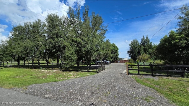 1022 Marble Ave, Avon Park, FL 33825 - view of street with gravel driveway and a gated entry
