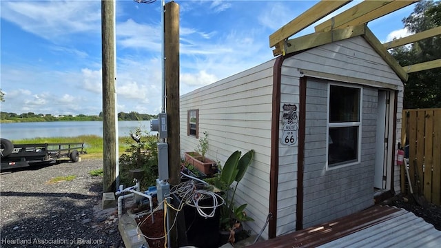 1022 Marble Ave, Avon Park, FL 33825 - view of shed featuring a water view and fence