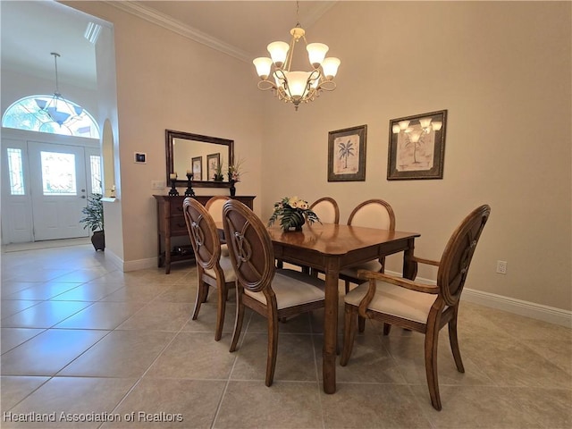 tiled dining room with an inviting chandelier, crown molding, and a towering ceiling