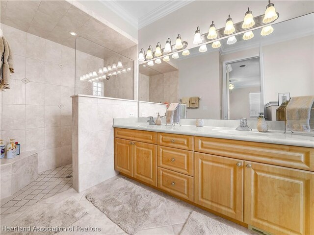 bedroom featuring crown molding, ceiling fan, ensuite bathroom, and light colored carpet