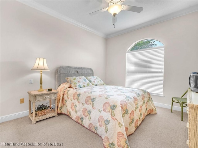 bedroom with ceiling fan, ornamental molding, and carpet