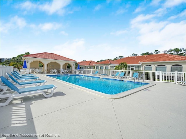 view of pool featuring a patio area