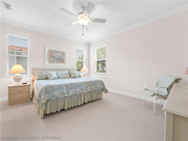 carpeted bedroom with multiple windows, ornamental molding, and ceiling fan