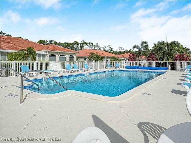 view of swimming pool with a patio