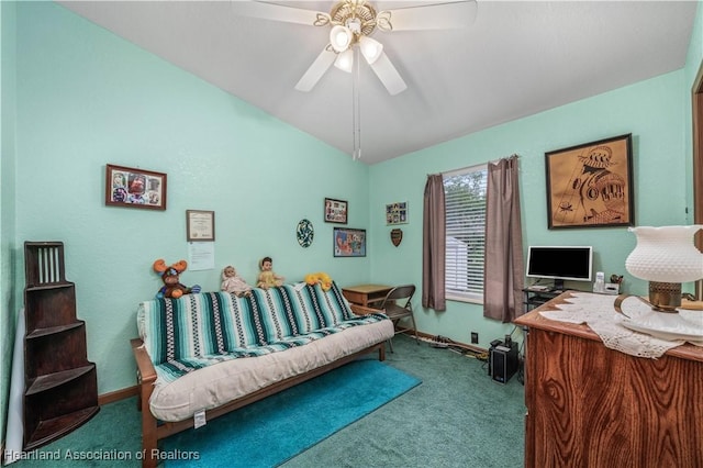 office space featuring carpet, vaulted ceiling, and ceiling fan