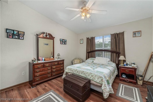 bedroom featuring vaulted ceiling, ceiling fan, and dark wood-type flooring