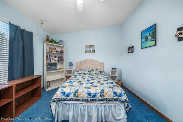 bedroom featuring ceiling fan, carpet floors, and lofted ceiling