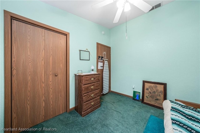 living area featuring ceiling fan and dark colored carpet