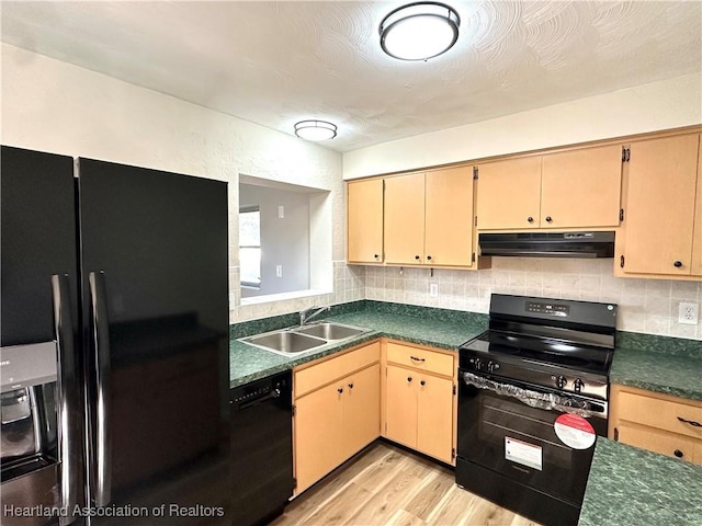 kitchen featuring black appliances, light hardwood / wood-style flooring, light brown cabinetry, and sink