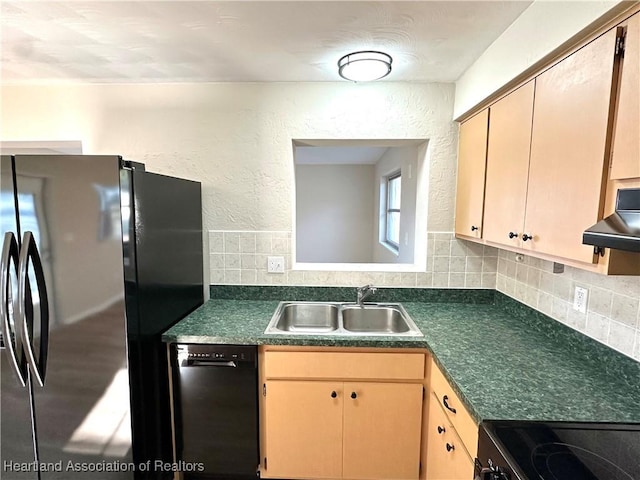 kitchen with sink, light brown cabinets, refrigerator, and black dishwasher