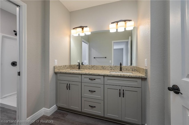 bathroom featuring vanity and hardwood / wood-style flooring