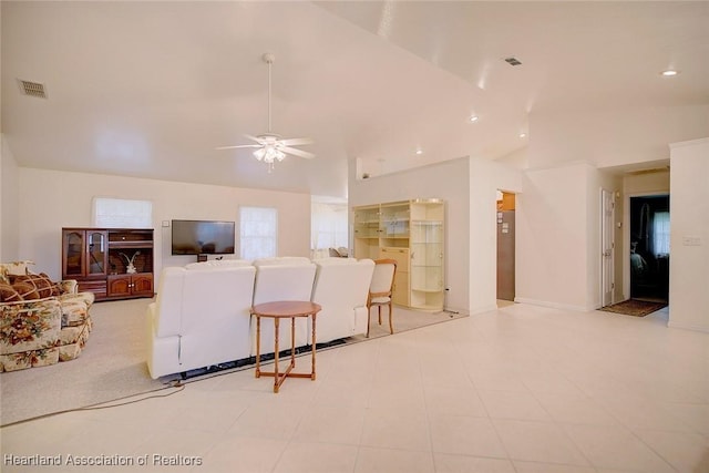 living room with high vaulted ceiling and ceiling fan